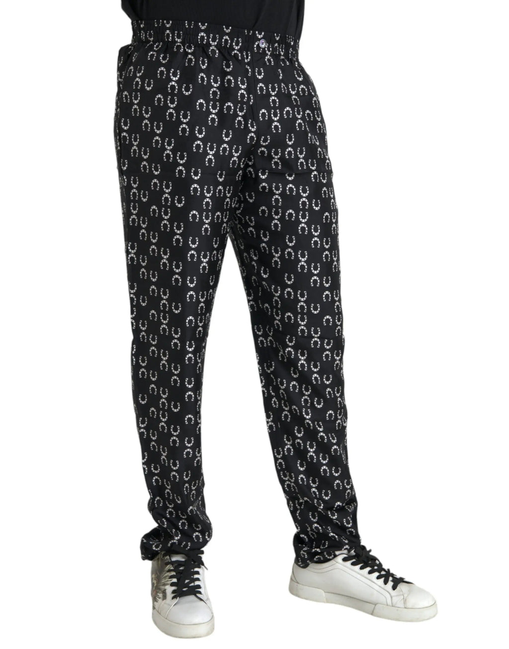 Pantalon en soie noir dolce gabbana avec motif fer à cheval blanc répétitif sur les joggers