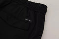 Pantalon de jogging dolce & gabbana noir en laine avec taille élastique et étiquette de marque sur la poche