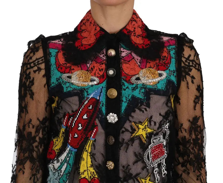 Blouse noire en dentelle dolce & gabbana avec appliqués colorés de planètes et fusées brodées style espace