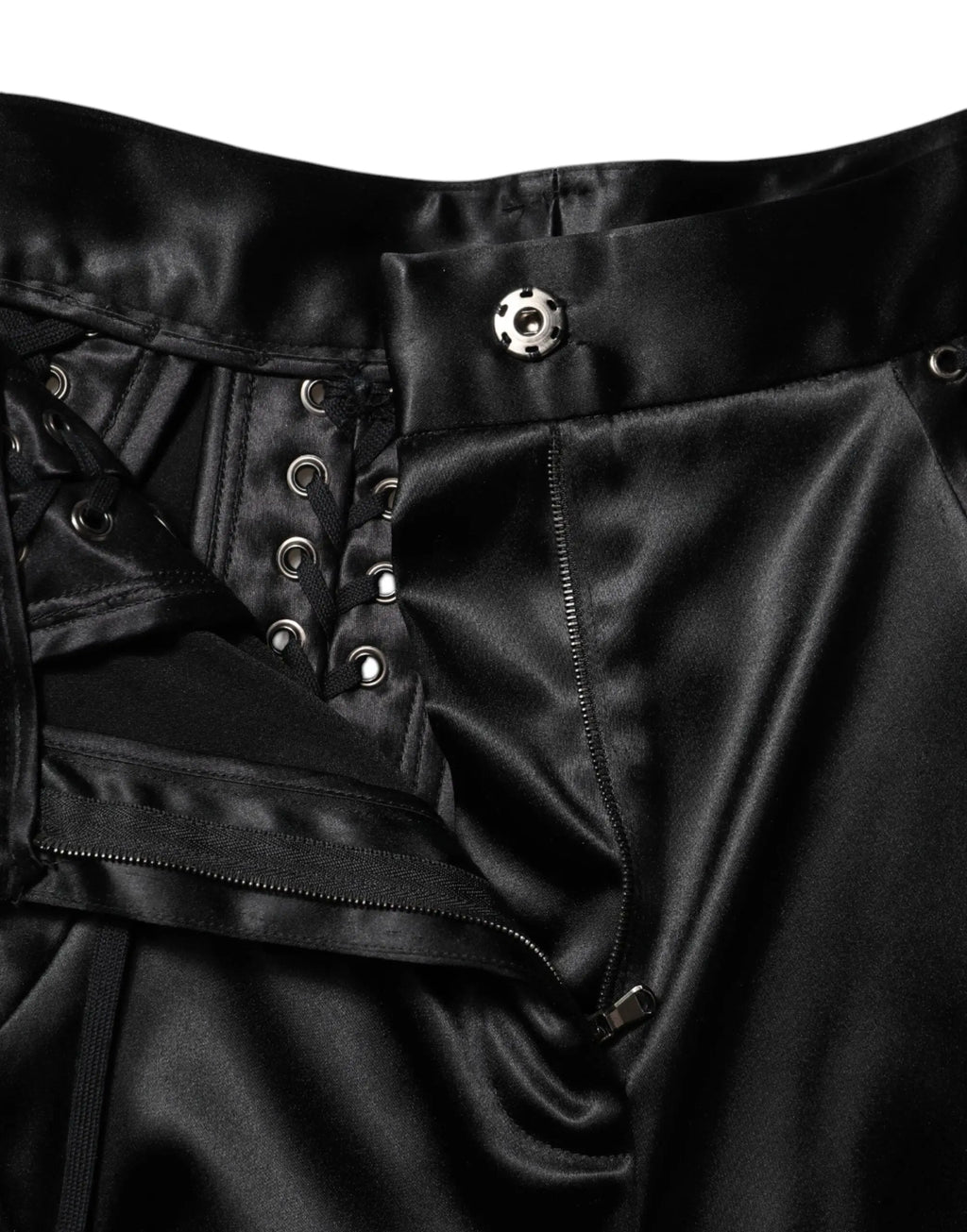Pantalon skinny taille haute dolce & gabbana en satin noir avec détails en dentelle et œillets argentés style corset