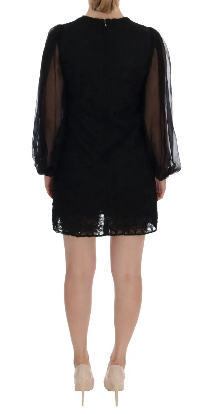 Robe noire dolce et gabbana avec manches bouffantes transparentes et ourlet en dentelle rouge en forme de coeur