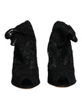 Dolce & gabbana bottines mi-mollet en dentelle noire avec talons stretch et noeud volanté vu de dos