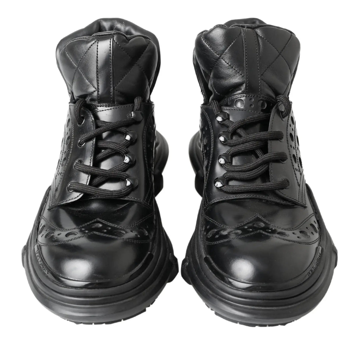 Dolce & gabbana bottines noires en cuir verni avec détails matelassés perforations et semelles épaisses