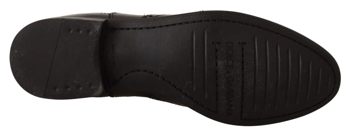 Semelle de bottines plates noires en cuir noir dolce gabbana avec motif antidérapant et logo embossé