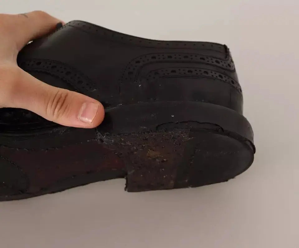 Dolce & gabbana chaussures oxford en cuir noir avec détails perforés brogue et semelle usée