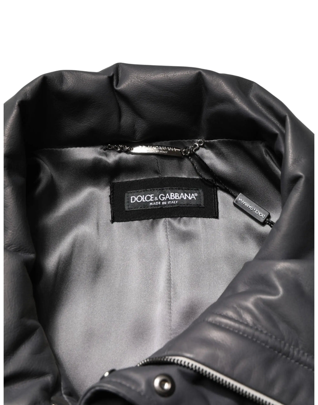 Veste trench dolce & gabbana noire en cuir avec doublure satinée et étiquette de marque visible