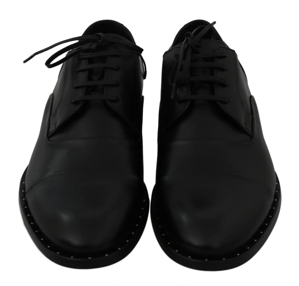 Dolce & gabbana chaussures derby en cuir noir avec surpiqûres blanches distinctives et finition brillante