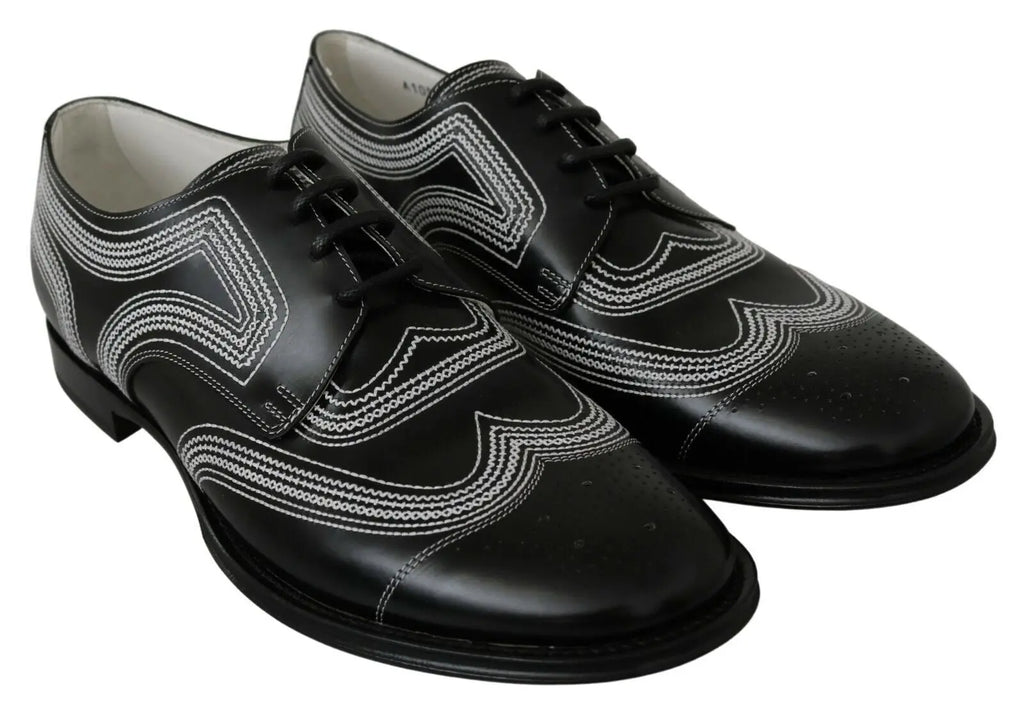 Dolce & gabbana chaussures derby en cuir noir avec motifs brogues blancs pour un look formel élégant