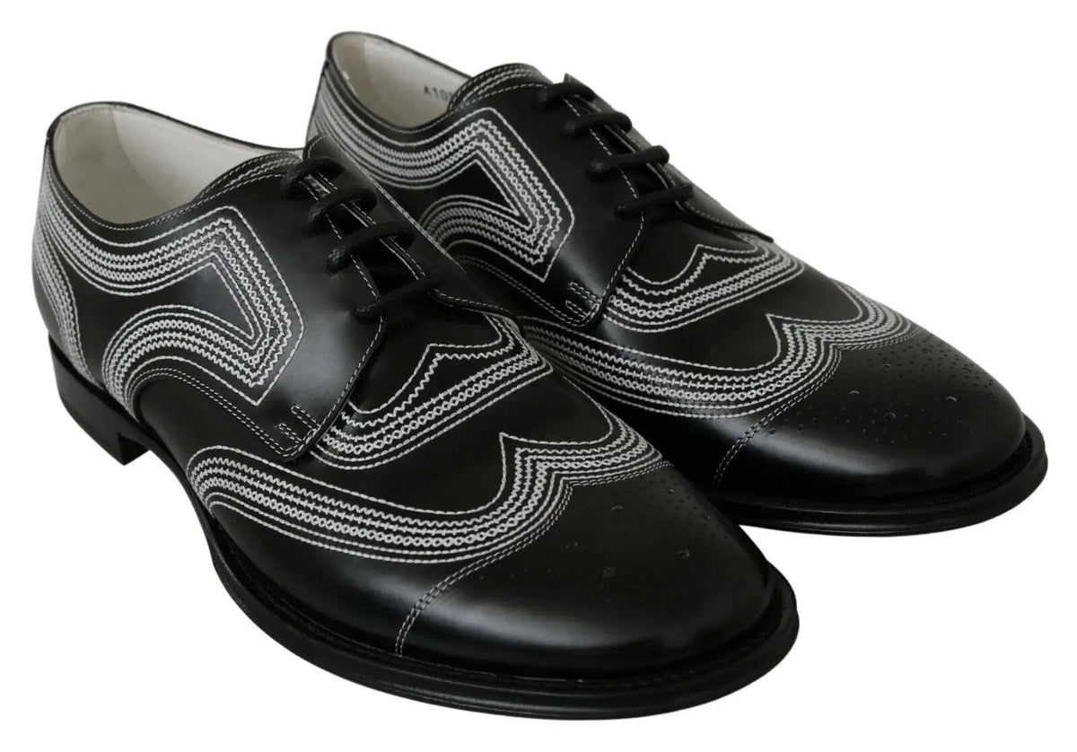 Dolce & gabbana chaussures derby en cuir noir avec motifs brogues blancs pour un look formel élégant