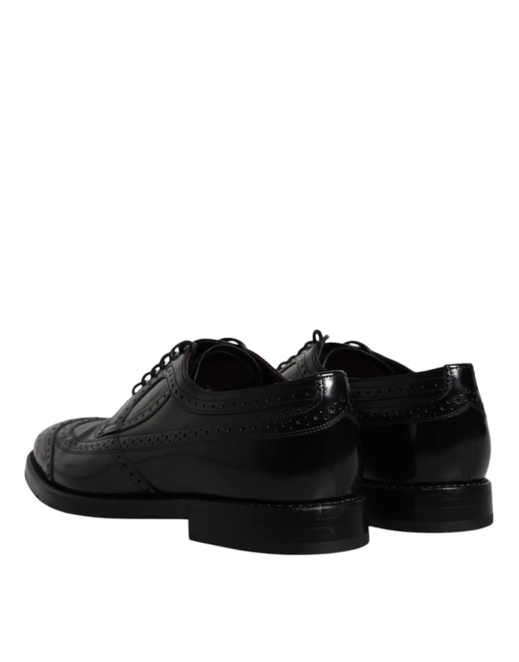 Dolce & gabbana derby wingtip formelles noir en cuir avec une finition polie et des perforations détaillées