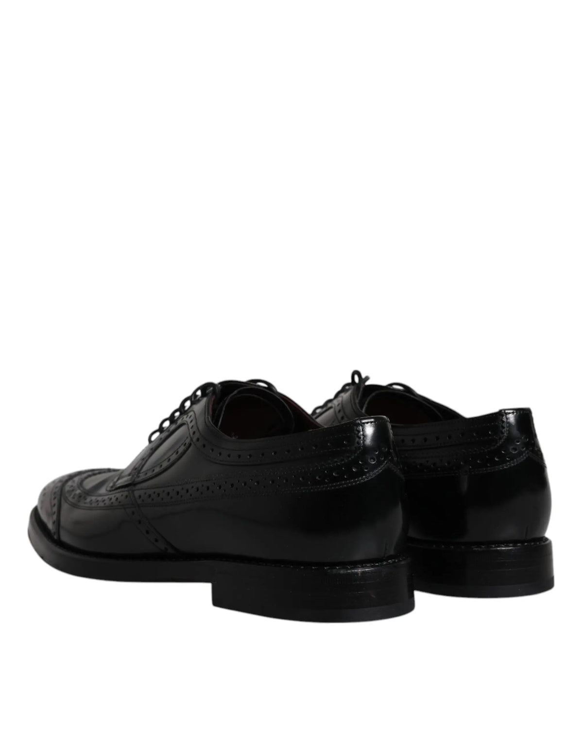 Dolce & gabbana derby wingtip formelles noir en cuir avec une finition polie et des perforations détaillées