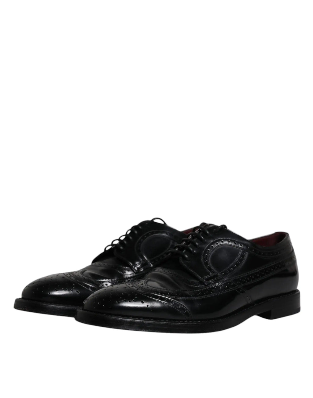 Dolce & gabbana chaussures derby wingtip formelles en cuir noir avec finition vernie et détails perforés raffinés