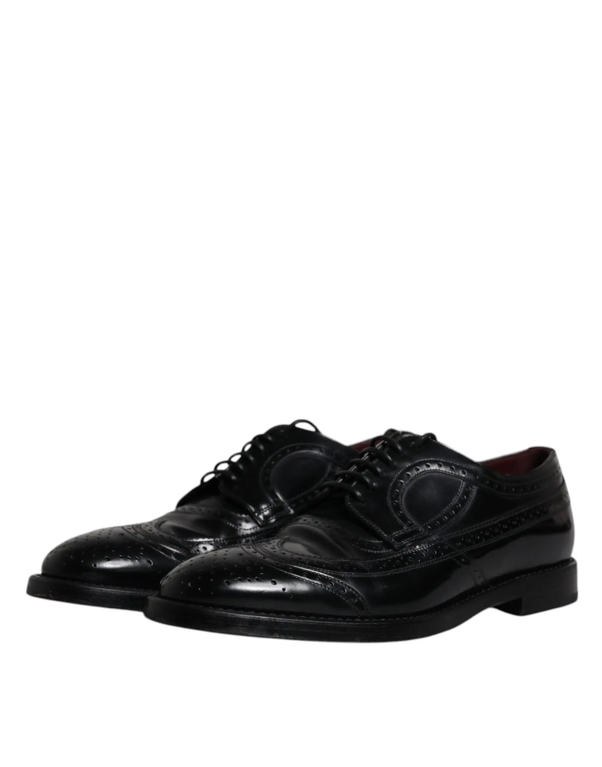 Dolce & gabbana chaussures derby wingtip formelles en cuir noir avec finition vernie et détails perforés raffinés