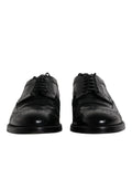 Dolce & gabbana chaussures derby noires en cuir avec finition brillante et détails perforés style brogue formel
