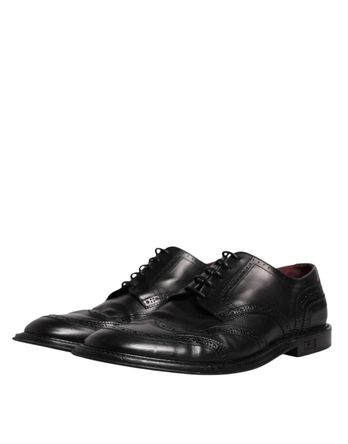Dolce & gabbana chaussures derby noires en cuir avec perforations détaillées et finition polie, style formel