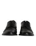 Dolce & gabbana chaussures derby wingtip noires en cuir avec finition polie et détails perforés pour tenue formelle