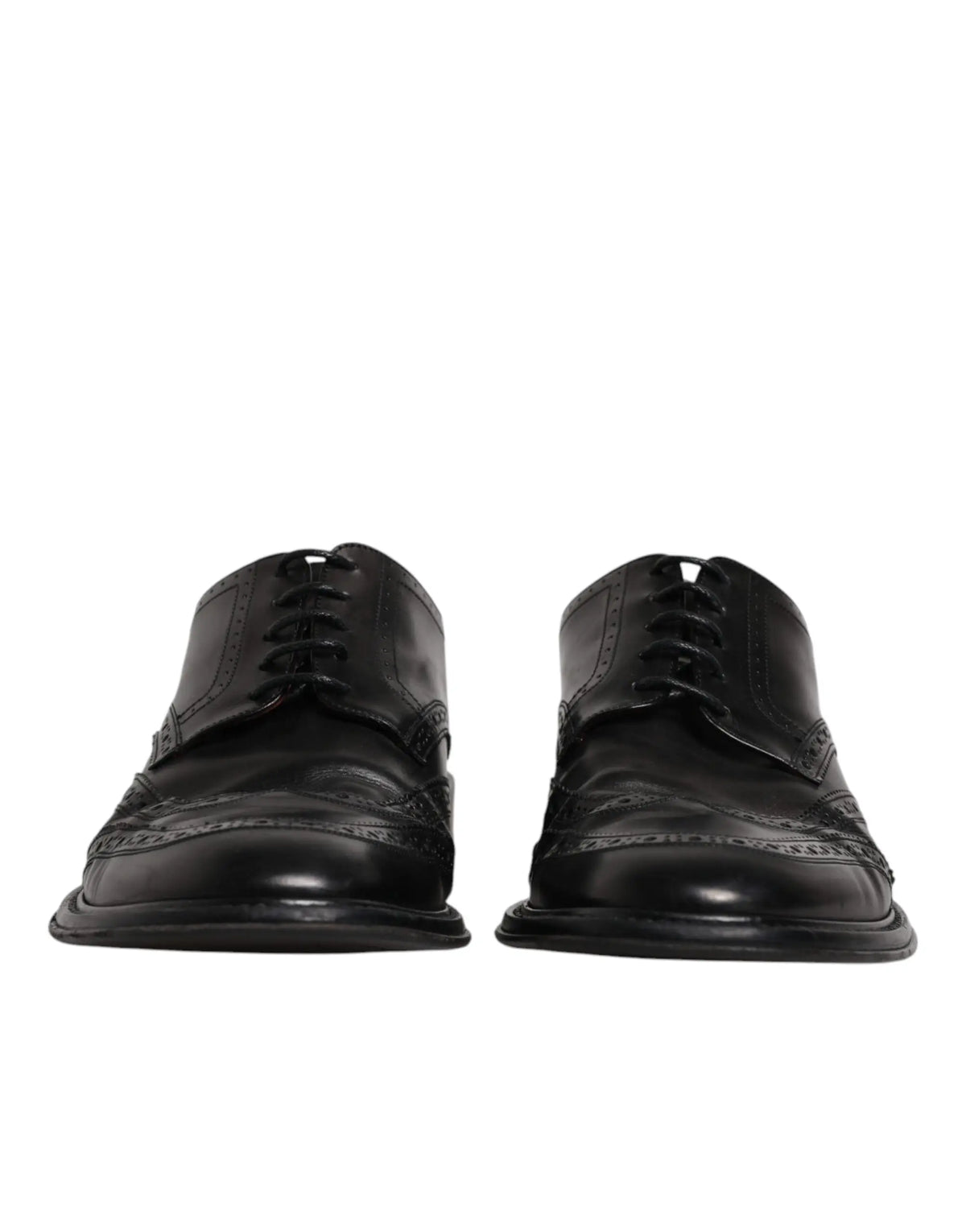 Dolce & gabbana chaussures derby wingtip noires en cuir avec finition polie et détails perforés pour tenue formelle