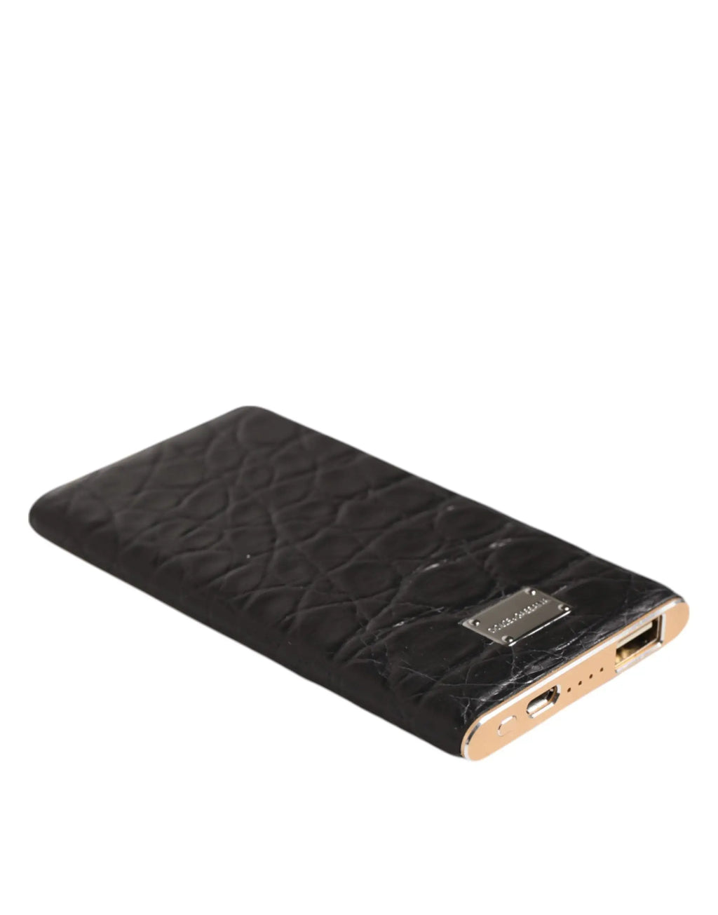 Black crocodile embossed leather power bank with gold-tone edges and metallic plaque by dolce & gabbana