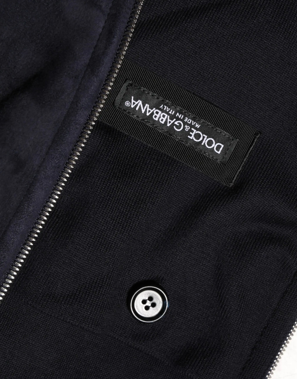 Veste noire dolce & gabbana en cuir à fermeture éclair intégrale avec texture côtelée en maille et zip argenté
