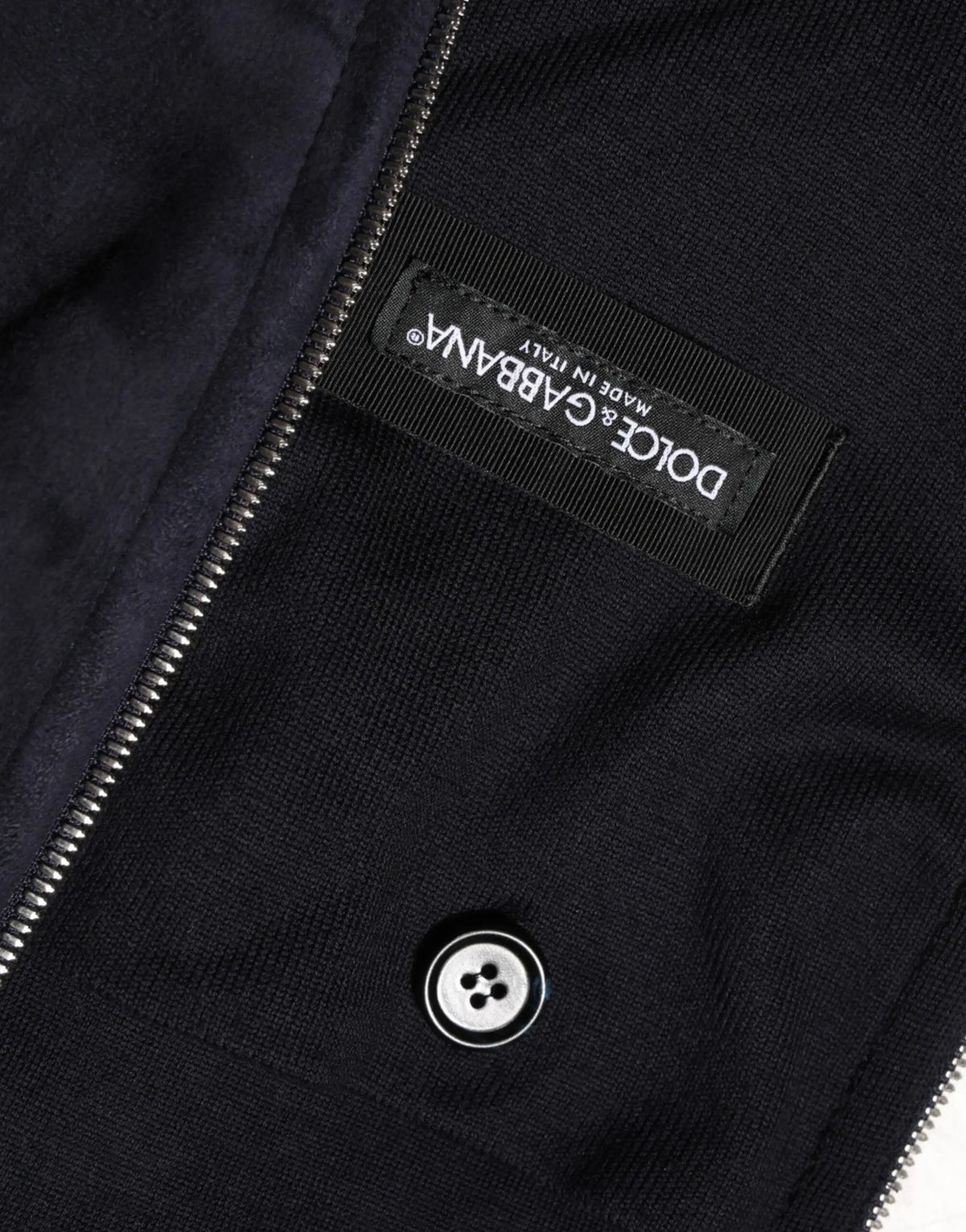 Veste noire dolce & gabbana en cuir à fermeture éclair intégrale avec texture côtelée en maille et zip argenté