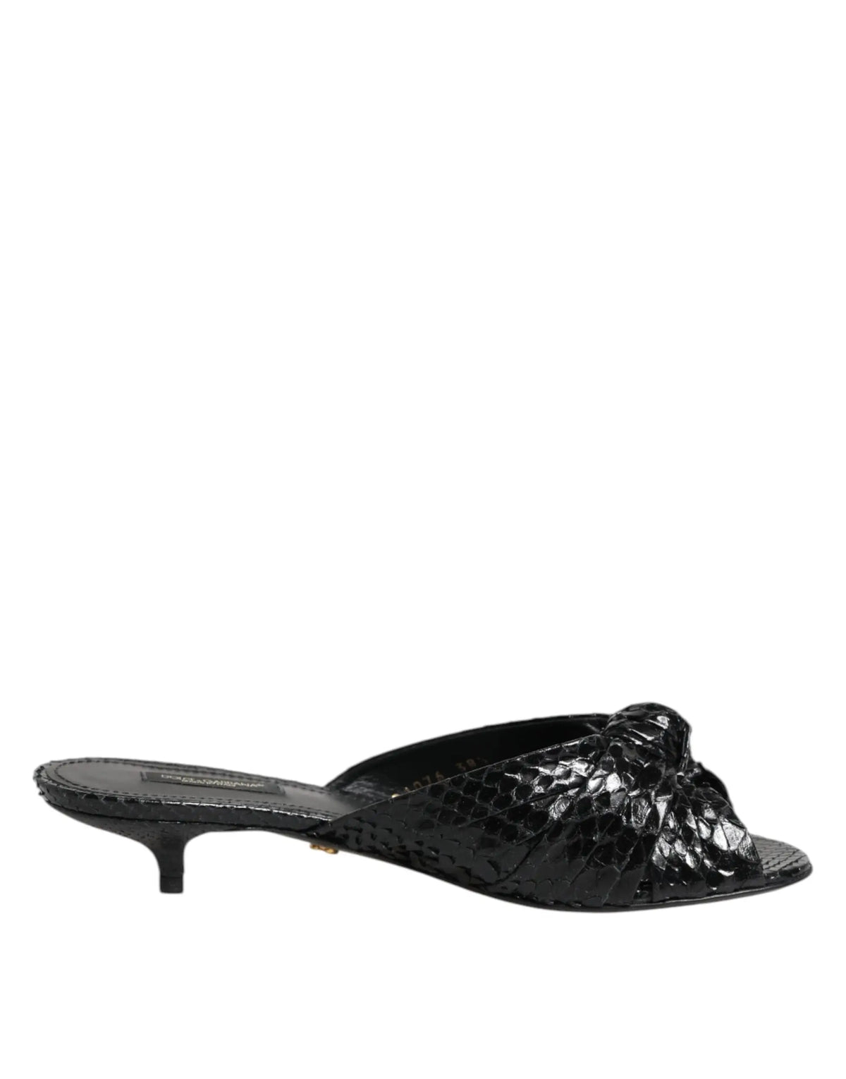 Dolce & gabbana mule sandal en cuir noir à imprimé serpent avec talon bas et nœud décoratif sur l’avant