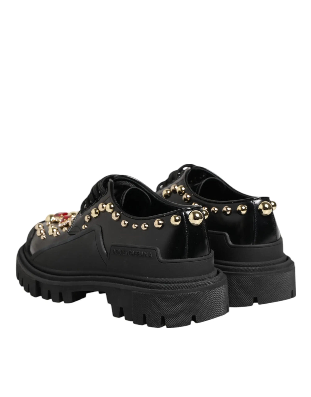 Dolce & gabbana derby en cuir noir avec plateau, clous dorés et pierres précieuses rouges
