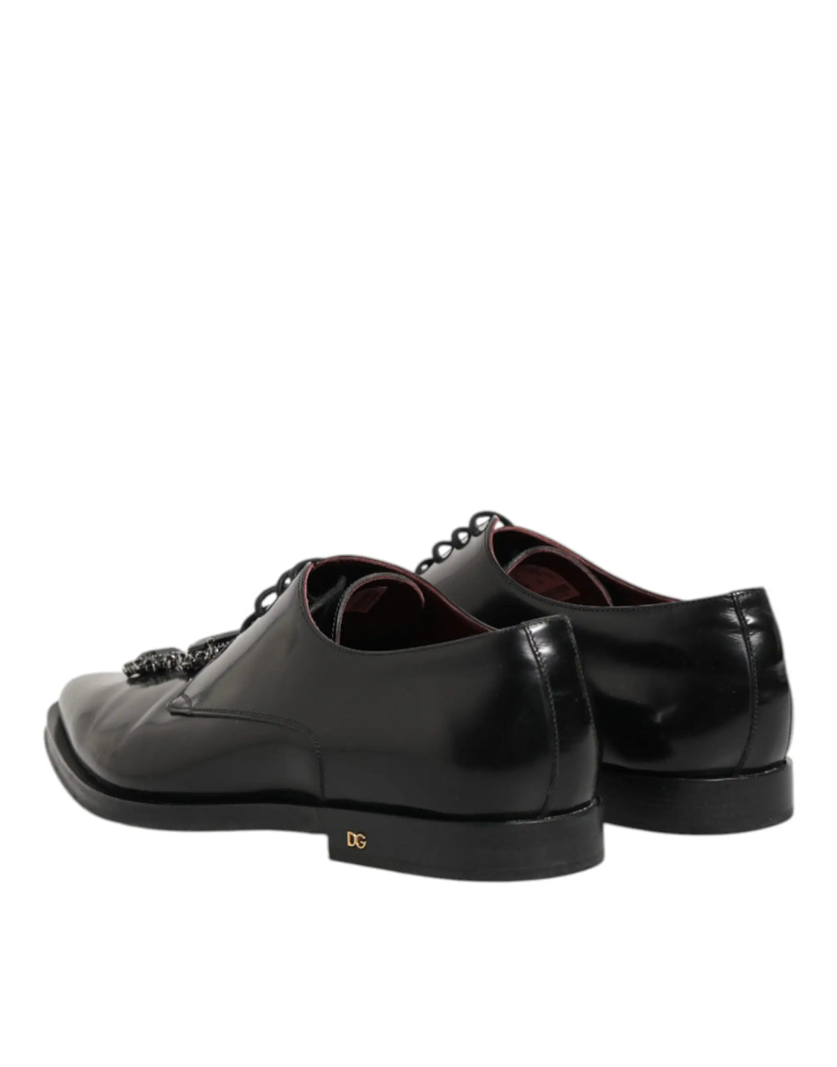 Chaussures derby dolce & gabbana en cuir noir verni avec gland décoratif et logo doré au talon