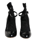 Dolce & Gabbana bottines à talons en cuir noir verni avec lacets et broderie florale