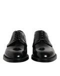 Dolce & gabbana chaussures derby noires en cuir verni avec finition polie et lacets classiques pour tenue formelle