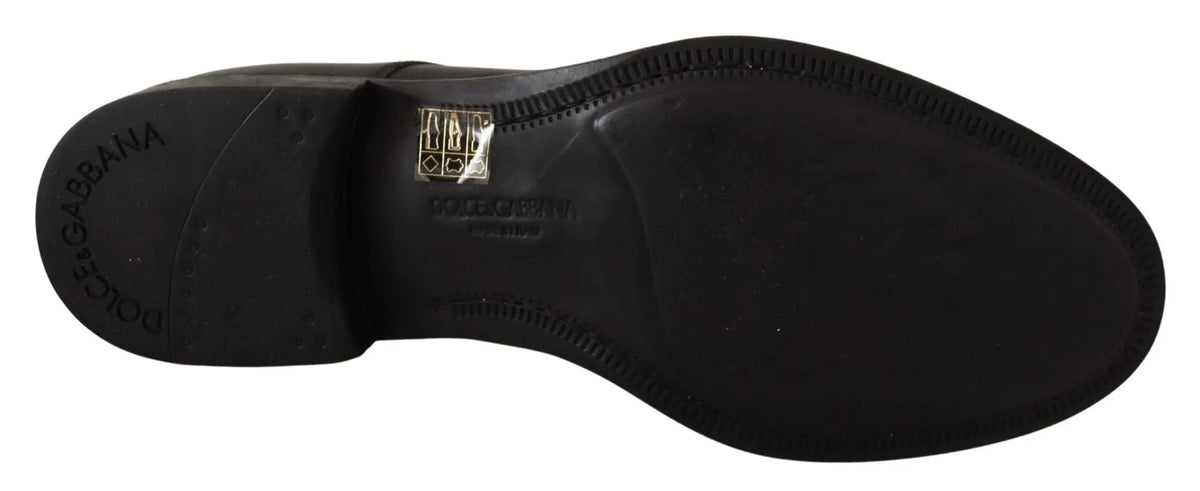 Semelle arrière de chaussure derby formelle homme en cuir noir dolce & gabbana avec logo embossé et étiquette dorée