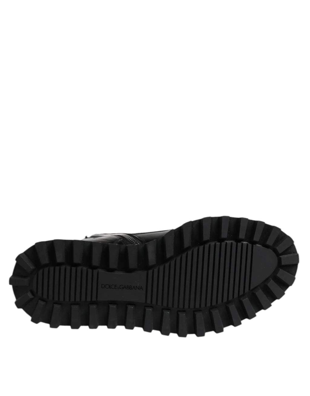 Semelle en caoutchouc noir avec rainures profondes et logo dolce & gabbana embossé au centre de bottes mi-mollet en cuir