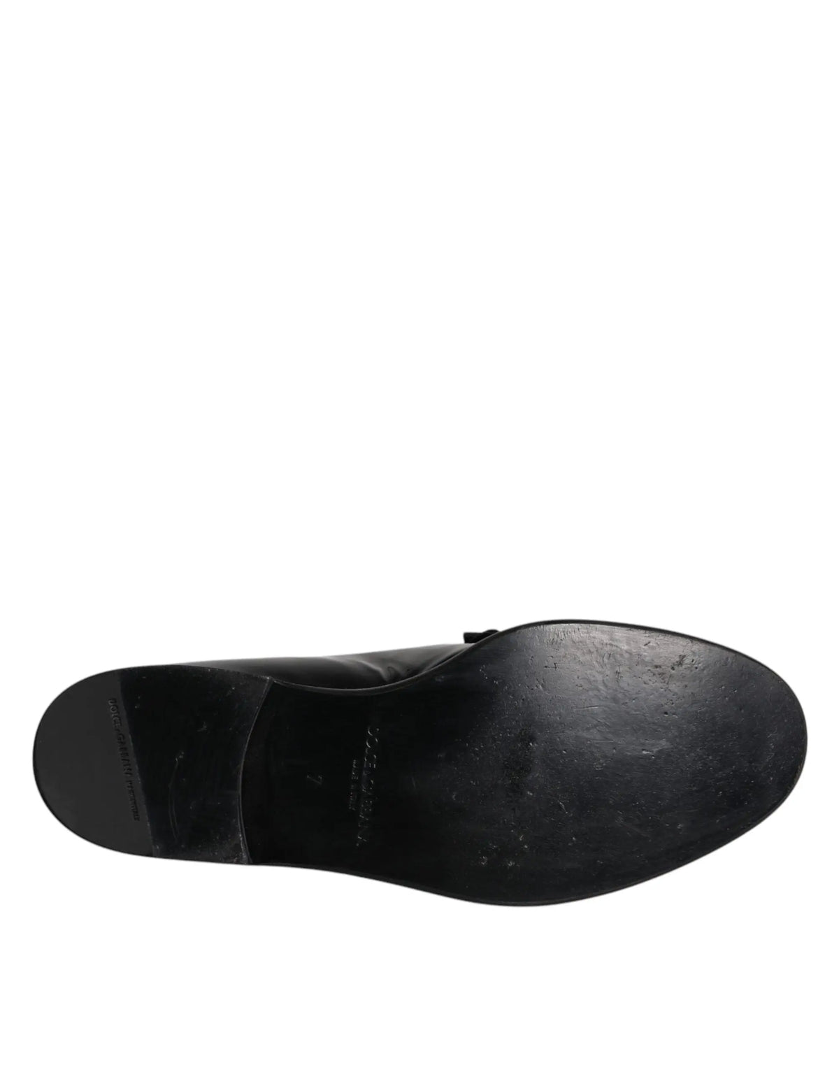 Dolce & gabbana mocassin en cuir noir pour homme vu de dos avec semelle légèrement usée et logo discret au talon