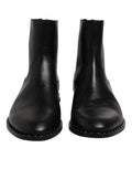 Bottes cheville en cuir noir dolce gabbana avec finition polie et clous argentés décoratifs le long de la semelle