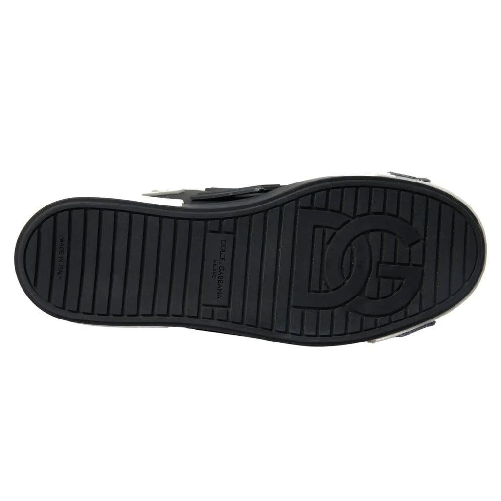 Semelle noire en caoutchouc embossée du logo dg et du branding dolce & gabbana des baskets basses portofino en cuir