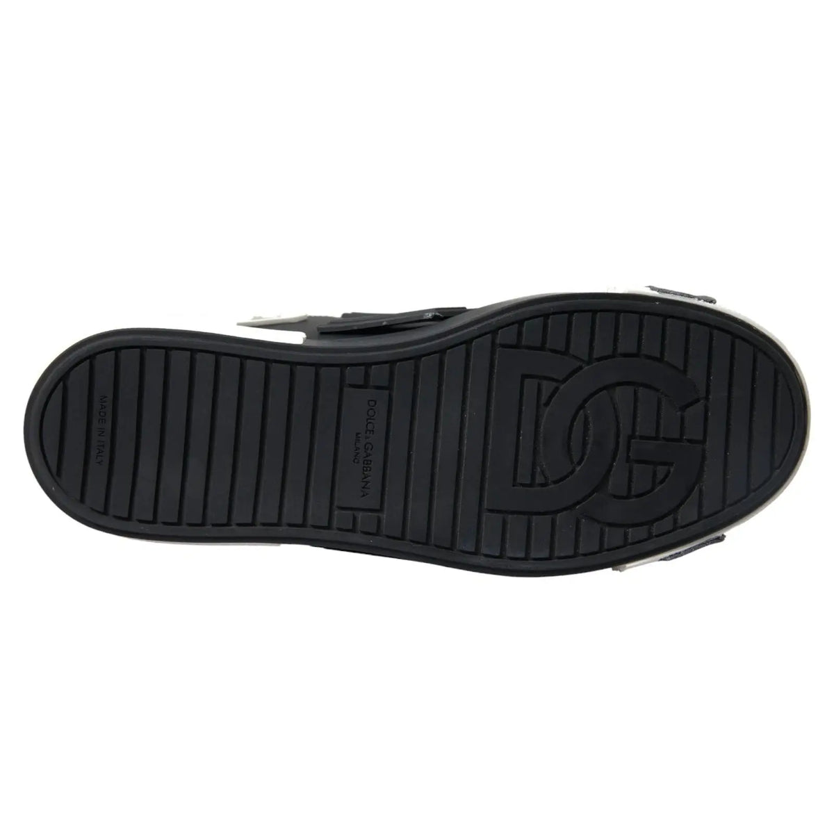 Semelle noire en caoutchouc embossée du logo dg et du branding dolce & gabbana des baskets basses portofino en cuir