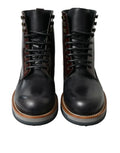 Bottes militaires dolce & gabbana en cuir noir à lacets avec finition brillante et coutures marron contrastées
