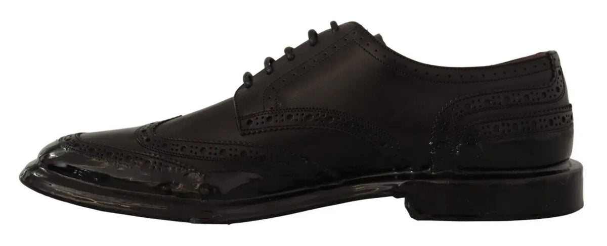 Chaussure derby formelle noire en cuir dolce gabbana avec finition brillante et motifs perforés détaillés