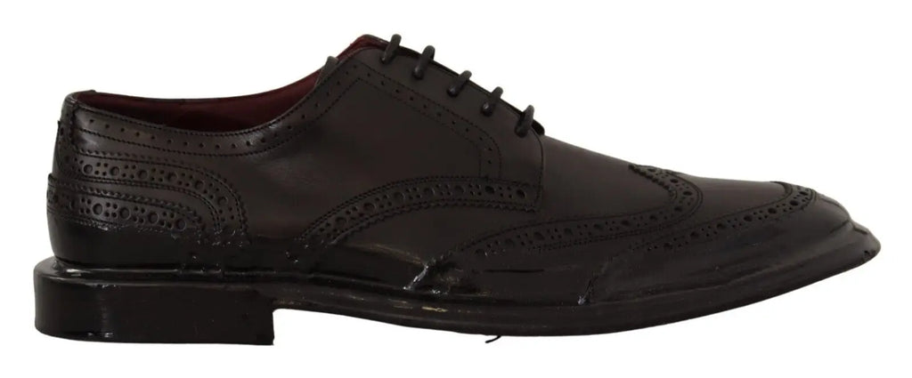 Chaussure derby formelle noire en cuir dolce & gabbana avec motifs perforés détaillés et finition polie