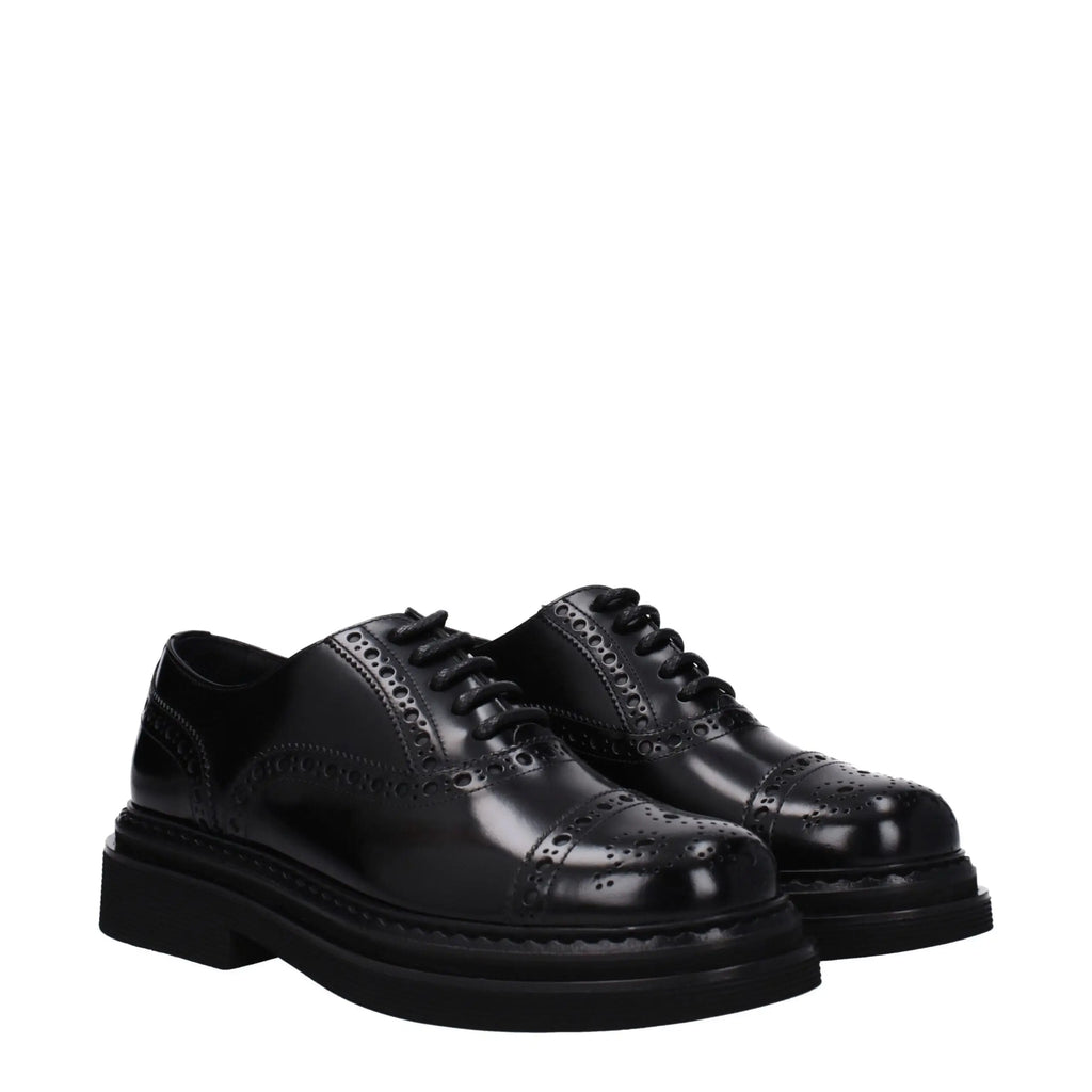 Dolce & gabbana chaussures oxford et derby en cuir noir verni avec semelle épaisse et design brogue