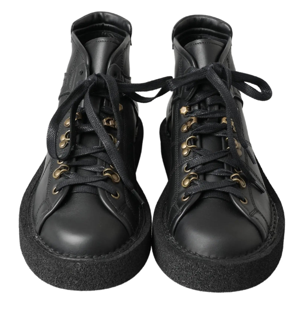 Bottes slip on stretch dolce & gabbana en cuir noir avec œillets dorés et semelle épaisse en caoutchouc