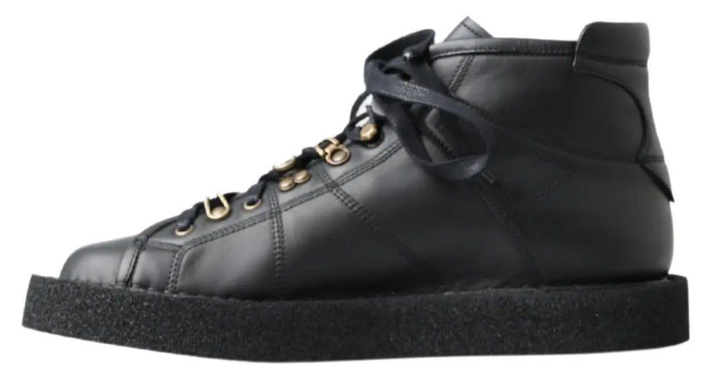 Dolce & gabbana bottes slip on stretch noires en cuir avec baskets montantes noires à œillets dorés et semelle en caoutchouc texturé