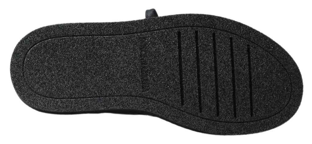 Semelle extérieure noire en caoutchouc avec grip texturé et rainures verticales des bottes slip on stretch en cuir dolce & gabbana