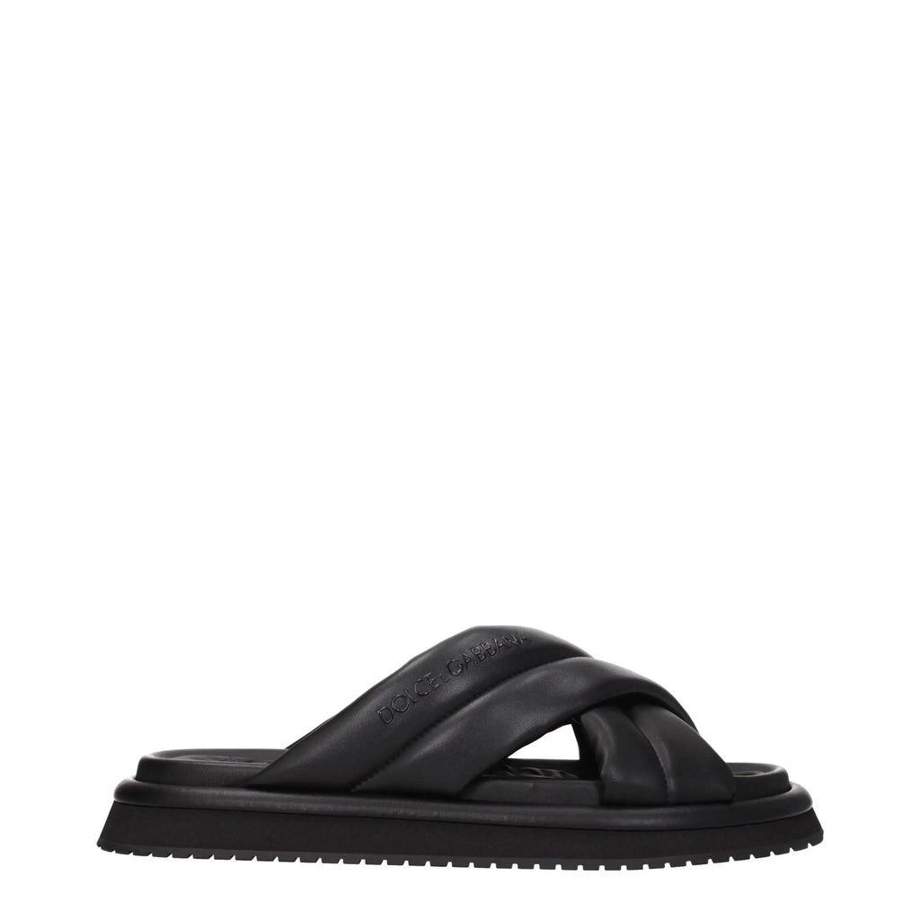 Dolce gabbana slippers en cuir noir avec brides croisées et semelle en caoutchouc chunky