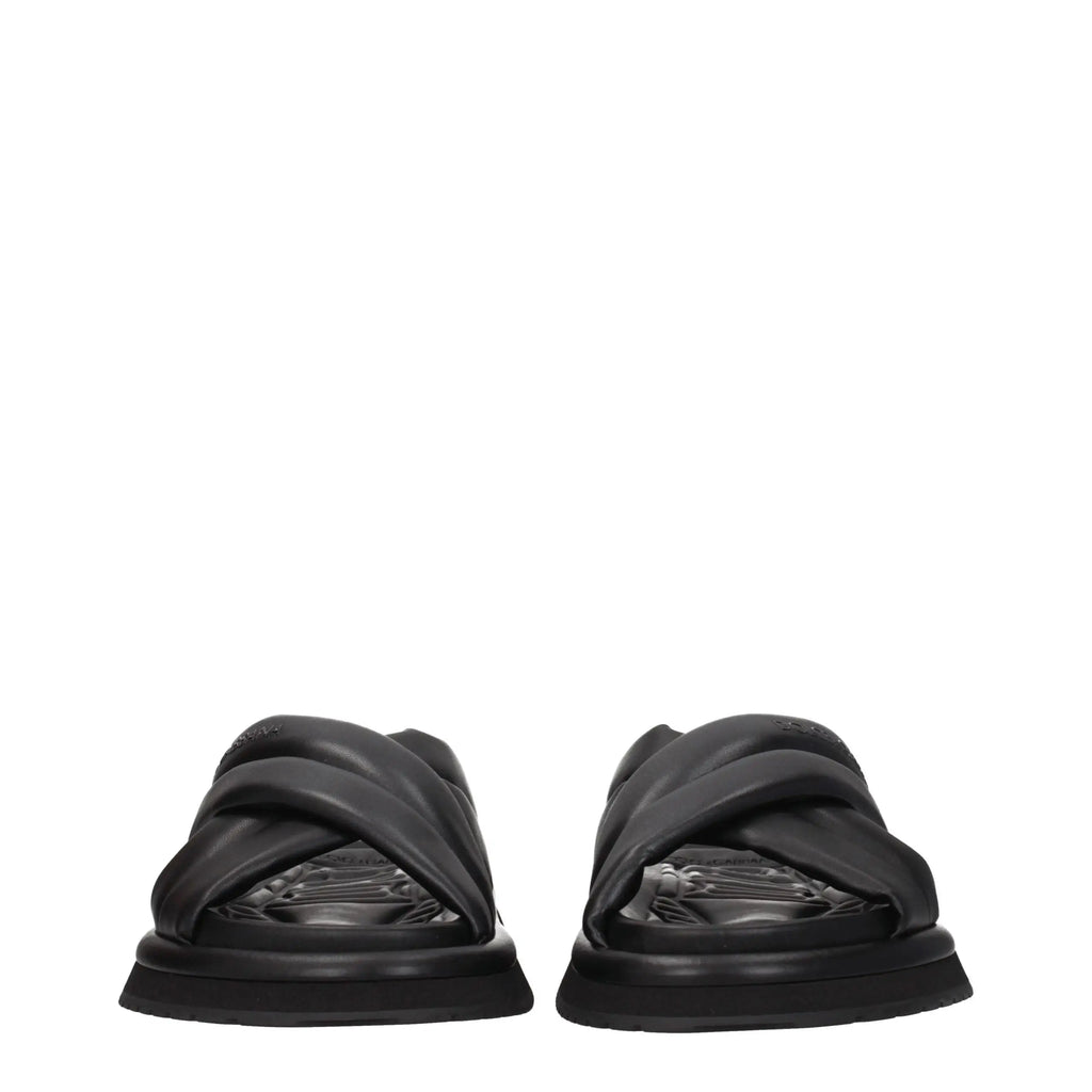Dolce & gabbana slippers en cuir noir avec semelle épaisse sculptée et design à lanières croisées