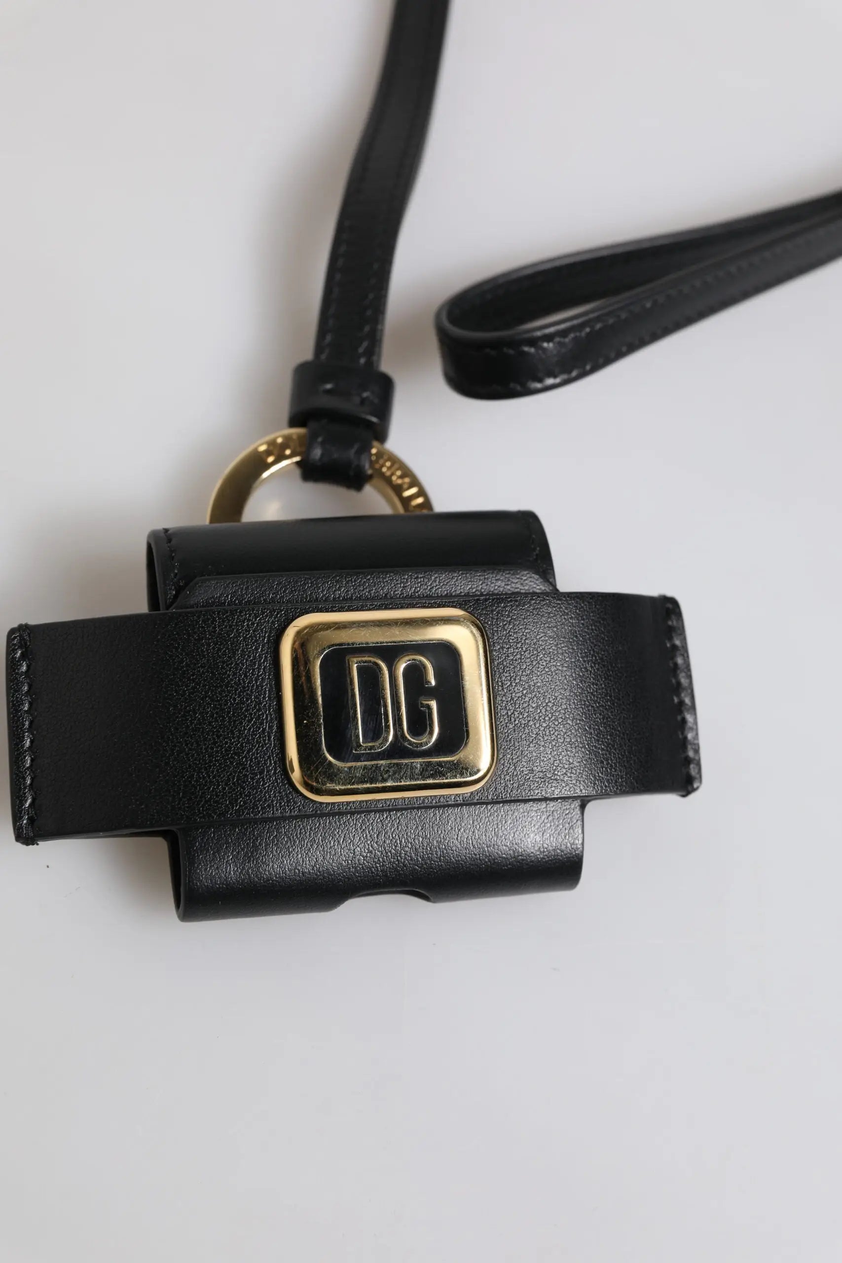 Black leather phone strap with gold tone dolce gabbana logo plaque for airpods case