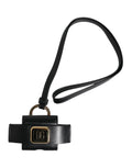 Bracelet de téléphone en cuir noir dolce & gabbana avec plaque logo dg en métal doré et bracelet de poignet ajustable