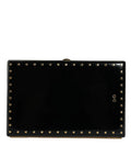 Pochette de soirée dolce & gabbana en cuir noir brillant avec clous dorés et logo dg sur le côté