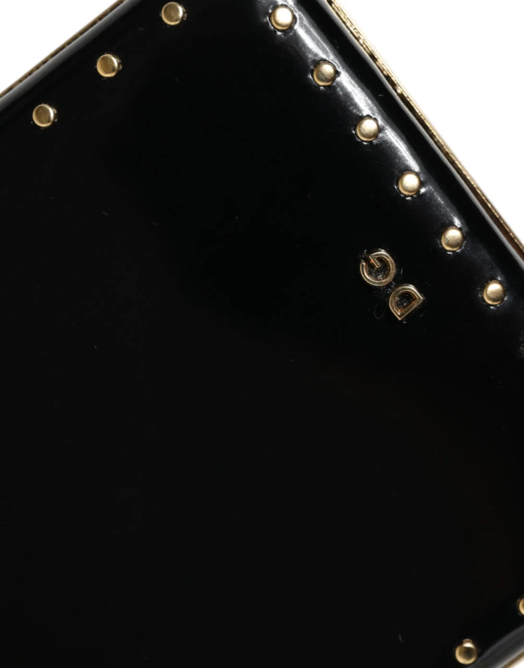Dolce & Gabbana clutch en cuir noir avec clous dorés et logo métallique pour soirée élégante