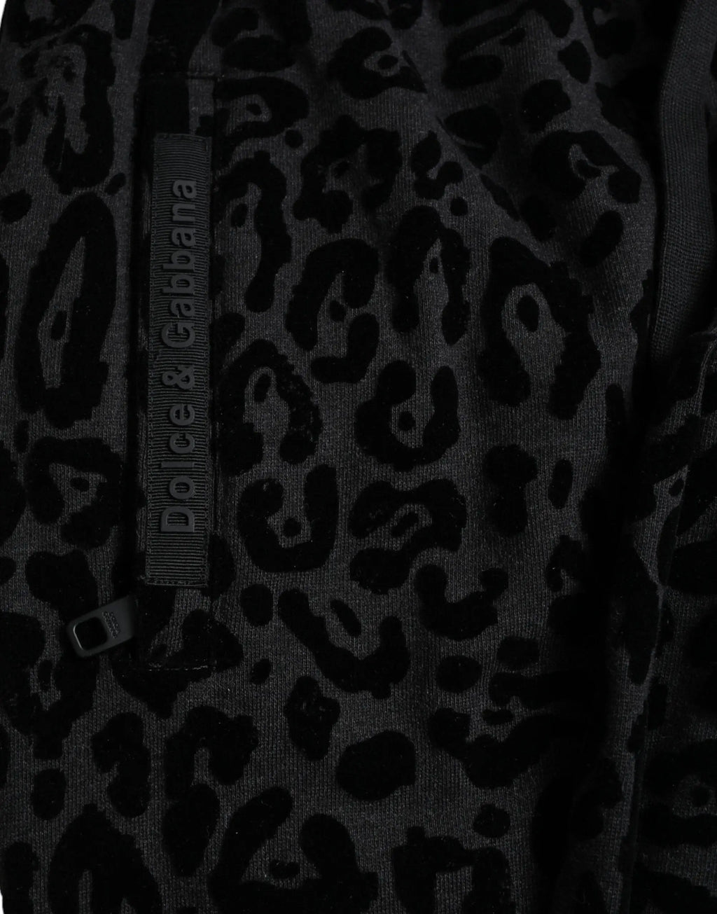 Pantalon slim jogger dolce & gabbana en coton noir imprimé léopard avec étiquette grise de la marque