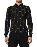 Polo noir dolce & gabbana en maille jacquard avec logos dg dorés et rayures verticales